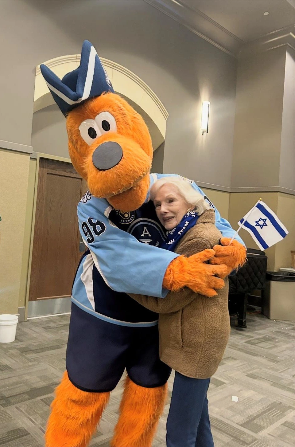 hugs from Roscoe, the MKE Admirals mascot hugs from Roscoe, the MKE Admirals mascot